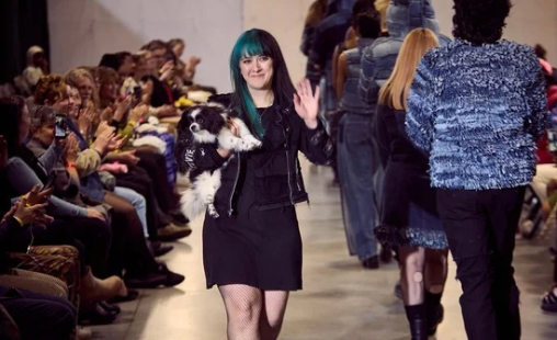 fashion designer stevie leigh and her dog sprinkles during the finale of her upcycled denim fashion show